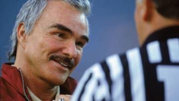 26 Aug 2000: Actor Burt Reynolds talks to the referee during the Pigskin Classic Game between the Florida State Seminoles and the BYU Cougars at the Alltel Stadium in Jacksonville, Florida. The Seminoles defeated the Cougars 23-3.Mandatory Credit: Craig Jones /Allsport