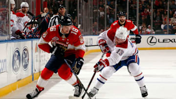 SUNRISE, FL - DECEMBER 28: Aleksander Barkov #16 of the Florida Panthers crosses sticks with Max Domi #13 of the Montreal Canadiens at the BB&T Center on December 28, 2018 in Sunrise, Florida. (Photo by Eliot J. Schechter/NHLI via Getty Images)