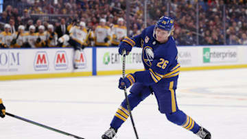Apr 1, 2022; Buffalo, New York, USA; Buffalo Sabres defenseman Rasmus Dahlin (26) takes a shot on goal during the second period against the Nashville Predators at KeyBank Center. Mandatory Credit: Timothy T. Ludwig-USA TODAY Sports