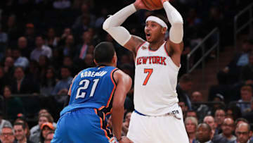 NEW YORK, NY - NOVEMBER 28: Carmelo Anthony #7 of the New York Knicks looks to pass around Andre Roberson #21 of the Oklahoma City Thunder during the second half at Madison Square Garden on November 28, 2016 in New York City. NOTE TO USER: User expressly acknowledges and agrees that, by downloading and or using this photograph, User is consenting to the terms and conditions of the Getty Images License Agreement. (Photo by Michael Reaves/Getty Images)