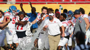 Jan 2, 2021; Tampa, FL, USA; Mississippi Rebels head coach Lane Kiffin gets a gatorade bath after they beat the Indiana Hoosiers at Raymond James Stadium. Mandatory Credit: Kim Klement-USA TODAY Sports