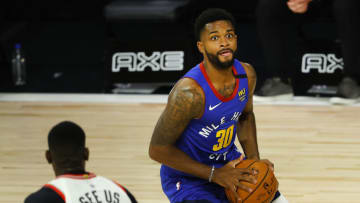 LAKE BUENA VISTA, FLORIDA - AUGUST 14: Troy Daniels #30 of the Denver Nuggets handles the ball during the second quarter against the Toronto Raptors at The Field House at ESPN Wide World Of Sports Complex on August 14, 2020 in Lake Buena Vista, Florida. NOTE TO USER: User expressly acknowledges and agrees that, by downloading and or using this photograph, User is consenting to the terms and conditions of the Getty Images License Agreement. (Photo by Mike Ehrmann/Getty Images)