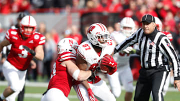 Nov 16, 2019; Lincoln, NE, USA; Nebraska Cornhuskers linebacker JoJo Domann (13) tackles Wisconsin Badgers wide receiver Quintez Cephus (87) in the first half at Memorial Stadium. Mandatory Credit: Bruce Thorson-USA TODAY Sports