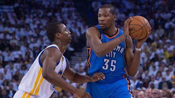 January 5, 2015; Oakland, CA, USA; Oklahoma City Thunder forward Kevin Durant (35) controls the basketball against Golden State Warriors forward Harrison Barnes (40) during the first quarter at Oracle Arena. The Warriors defeated the Thunder 117-91. Mandatory Credit: Kyle Terada-USA TODAY Sports