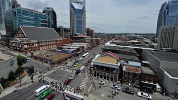 NASHVILLE, TN - JUNE 07: Fans crowd downtown Nashville during the 2012 CMA Music Festival on June 7, 2012 in Nashville, Tennessee. (Photo by Frederick Breedon IV/Getty Images)
