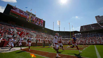 NORMAN, OK - APRIL 24: Quarterback Spencer Rattler #7 and the Oklahoma Sooners run onto the field for their spring game at Gaylord Family Oklahoma Memorial Stadium on April 24, 2021 in Norman, Oklahoma. (Photo by Brian Bahr/Getty Images)