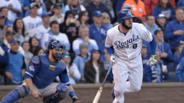 Oct 17, 2015; Kansas City, MO, USA; Kansas City Royals third baseman Mike Moustakas (8) hits an RBI single during the seventh inning against the Toronto Blue Jays in game two of the ALCS at Kauffman Stadium. Mandatory Credit: Denny Medley-USA TODAY Sports