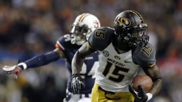 Dec 7, 2013; Atlanta, GA, USA; Missouri Tigers wide receiver Dorial Green-Beckham (15) runs for a touchdown pass against Auburn Tigers defensive back Ryan Smith (24) during the second quarter of the 2013 SEC Championship game at Georgia Dome. Mandatory Credit: Brett Davis-USA TODAY Sports