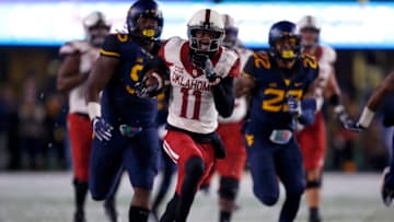 MORGANTOWN, WV - NOVEMBER 19: Dede Westbrook #11 of the Oklahoma Sooners scores on a 75 yard touchdown pass in the first half against the West Virginia Mountaineers on November 19, 2016 at Mountaineer Field in Morgantown, West Virginia. (Photo by Justin K. Aller/Getty Images)