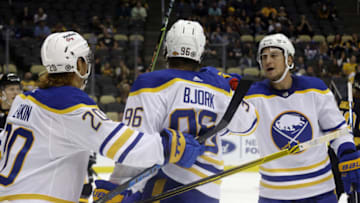Oct 5, 2021; Pittsburgh, Pennsylvania, USA; Buffalo Sabres left wing Anders Bjork (96) celebrates with center Cody Eakin (20) and left wing John Hayden (right) after scoring a goal against the Pittsburgh Penguins during the third period at PPG Paints Arena. The Penguins won 5-4 in a shootout. Mandatory Credit: Charles LeClaire-USA TODAY Sports