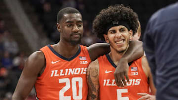 Nov 23, 2021; Kansas City, Missouri, USA; Illinois Fighting Illini guard Da'Monte Williams (20) walks with guard Andre Curbelo (5) to a timeout against the Kansas State Wildcats during the first half at T-Mobile Center. Mandatory Credit: Denny Medley-USA TODAY Sports