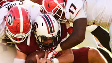 COLUMBIA, SC - OCTOBER 9: Quarterback Perry Orth No. 10 of the South Carolina Gamecocks is sacked by defensive lineman Tyler Clark No. 52 of the Georgia Bulldogs and outside linebacker Davin Bellamy #17 on October 9, 2016 at Williams-Brice Stadium in Columbia, South Carolina. (Photo by Todd Bennett/GettyImages)
