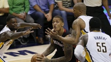 May 28, 2014; Indianapolis, IN, USA; Miami Heat forward Michael Beasley (8) goes up for a shot while being guarded by Indiana Pacers forward David West (21) during the fourth quarter in game five of the Eastern Conference Finals of the 2014 NBA Playoffs at Bankers Life Fieldhouse. Mandatory Credit: Aaron Doster-USA TODAY Sports