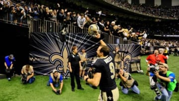 New Orleans Saints quarterback Drew Brees (9) celebrates after a win against the New York Giants in a game at the Mercedes-Benz Superdome. The Saints defeated the Giants 52-49. Mandatory Credit: Derick E. Hingle-USA TODAY Sports