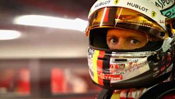 SINGAPORE - SEPTEMBER 15: Sebastian Vettel of Germany and Ferrari prepares to drive in the garage during qualifying for the Formula One Grand Prix of Singapore at Marina Bay Street Circuit on September 15, 2018 in Singapore. (Photo by Mark Thompson/Getty Images)