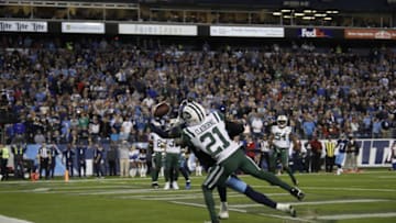 NASHVILLE, TN - DECEMBER 2: Tajae Sharpe #19 of the Tennessee Titans dives trying to catch a pass from Marcus Mariota #8 while defended by Morris Claiborne #21 of the New York Jets during the fourth quarter at Nissan Stadium on December 2, 2018 in Nashville, Tennessee. (Photo by Frederick Breedon/Getty Images)