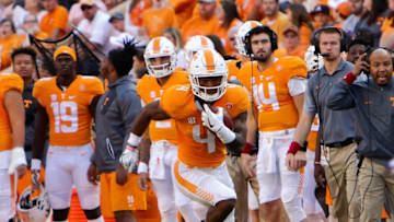 Nov 5, 2016; Knoxville, TN, USA; Tennessee Volunteers running back John Kelly (4) runs the ball against the Tennessee Tech Golden Eagles during the first quarter at Neyland Stadium. Mandatory Credit: Randy Sartin-USA TODAY Sports