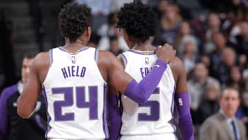 SACRAMENTO, CA - JANUARY 12: Buddy Hield #24 and De'Aaron Fox #5 of the Sacramento Kings talk during the game against the Charlotte Hornets on January 12, 2019 at Golden 1 Center in Sacramento, California. NOTE TO USER: User expressly acknowledges and agrees that, by downloading and or using this photograph, User is consenting to the terms and conditions of the Getty Images Agreement. Mandatory Copyright Notice: Copyright 2019 NBAE (Photo by Rocky Widner/NBAE via Getty Images)