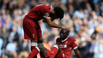 MANCHESTER, ENGLAND - SEPTEMBER 09: Mohamed Salah of Liverpool comforts Sadio Mane of Liverpool after he reacts to being sent off during the Premier League match between Manchester City and Liverpool at Etihad Stadium on September 9, 2017 in Manchester, England. (Photo by Stu Forster/Getty Images)