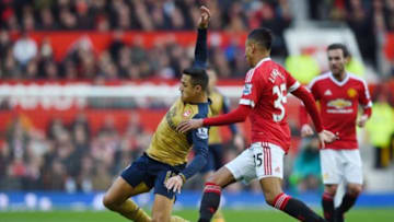 MANCHESTER, ENGLAND - FEBRUARY 28: Alexis Sanchez of Arsenal is challenged by Jesse Lingard of Manchester United during the Barclays Premier League match between Manchester United and Arsenal at Old Trafford on February 28, 2016 in Manchester, England. (Photo by Shaun Botterill/Getty Images)