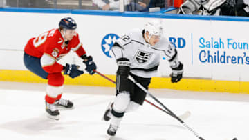 SUNRISE, FL - DECEMBER 16: Cole Schwindt #79 of the Florida Panthers pursues Trevor Moore #12 of the Los Angeles Kings at the FLA Live Arena on December 16, 2021 in Sunrise, Florida. (Photo by Joel Auerbach/Getty Images)