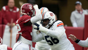 Auburn footballNov 26, 2022; Tuscaloosa, Alabama, USA; Auburn Tigers offensive lineman E.J. Harris (56) blocks Alabama Crimson Tide linebacker Deontae Lawson (32) at Bryant-Denny Stadium. Mandatory Credit: Marvin Gentry-USA TODAY Sports