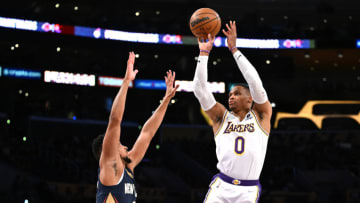 Los Angeles Lakers guard Russell Westbrook (0) is defended by New Orleans Pelicans guard CJ McCollum Credit: Jayne Kamin-Oncea-USA TODAY Sports