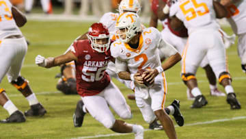 Nov 7, 2020; Fayetteville, Arkansas, USA; Tennessee Volunteers quarterback Jarrett Guarantano (2) runs the ball as Arkansas Razorbacks linebacker Zach Williams (56) defends in the first quarter at Donald W. Reynolds Razorback Stadium. Mandatory Credit: Nelson Chenault-USA TODAY Sports