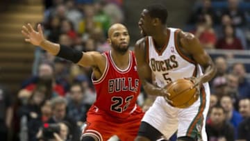 Jan 10, 2014; Milwaukee, WI, USA; Chicago Bulls forward Taj Gibson (22) defends Milwaukee Bucks forward Ekpe Udoh (5) during the second quarter at BMO Harris Bradley Center. Mandatory Credit: Jeff Hanisch-USA TODAY Sports