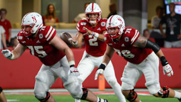 LINCOLN, NE - SEPTEMBER 14: Quarterback Adrian Martinez #2 of the Nebraska Cornhuskers takes a snap as offensive lineman Trent Hixson #75 and offensive lineman Brenden Jaimes #76 block against the Northern Illinois Huskies at Memorial Stadium on September 14, 2019 in Lincoln, Nebraska. (Photo by Steven Branscombe/Getty Images)