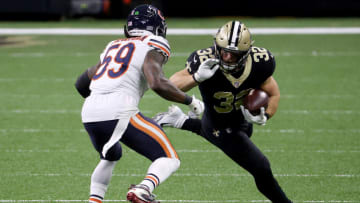 NEW ORLEANS, LOUISIANA - JANUARY 10: Michael Burton #32 of the New Orleans Saints runs with the ball against Danny Trevathan #59 of the Chicago Bears during the first quarter in the NFC Wild Card Playoff game at Mercedes Benz Superdome on January 10, 2021 in New Orleans, Louisiana. (Photo by Chris Graythen/Getty Images)
