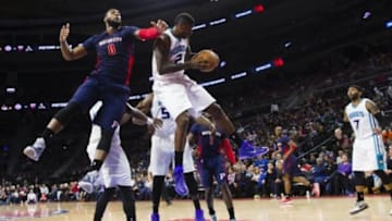 Mar 8, 2015; Auburn Hills, MI, USA; Charlotte Hornets forward Marvin Williams (2) grabs the rebound over Detroit Pistons center Andre Drummond (0) in the third quarter at The Palace of Auburn Hills. Charlotte won 108-101. Mandatory Credit: Rick Osentoski-USA TODAY Sports