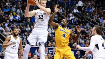 Dec 22, 2016; Provo, UT, USA; Brigham Young Cougars forward Eric Mika (12) grabs a defensive rebound against the Cal State Bakersfield Roadrunners during the first half at Marriott Center. Mandatory Credit: Chris Nicoll-USA TODAY Sports