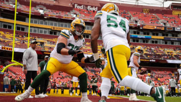 LANDOVER, MD - OCTOBER 23: Royce Newman #70 and LaDarius Hamilton #54 of the Green Bay Packers warm up before the game against the Washington Commanders at FedExField on October 23, 2022 in Landover, Maryland. (Photo by Scott Taetsch/Getty Images)