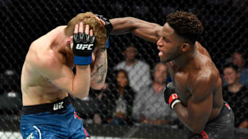 CALGARY, AB - JULY 28: (R-L) Hakeem Dawodu of Canada punches Austin Arnett in their featherweight bout during the UFC Fight Night event at Scotiabank Saddledome on July 28, 2018 in Calgary, Alberta, Canada. (Photo by Jeff Bottari/Zuffa LLC/Zuffa LLC via Getty Images)