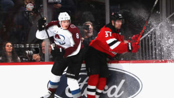 NEWARK, NEW JERSEY - JANUARY 04: Cale Makar #8 of the Colorado Avalanche collides with Pavel Zacha #37 of the New Jersey Devils at the Prudential Center on January 04, 2020 in Newark, New Jersey. (Photo by Bruce Bennett/Getty Images)