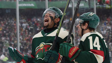 MINNEAPOLIS, MN - FEBRUARY 21: Matt Dumba #24 of the Minnesota Wild celebrates his goal along with Justin Fontaine #14 at 3:25 of the first period against the Chicago at the TCF Bank Stadium during the 2016 Coors Light Stadium Series game on February 21, 2016 in Minneapolis, Minnesota. (Photo by Hannah Foslien/Getty Images)