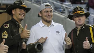 Nov 7, 2015; College Station, TX, USA; Cleveland Browns quarterback Johnny Manziel poses for a picture before a game between the Texas A&M Aggies and the Auburn Tigers at Kyle Field. Mandatory Credit: Troy Taormina-USA TODAY Sports