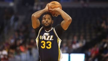 Nov 5, 2015; Denver, CO, USA; Utah Jazz forward Trevor Booker (33) shoots the ball during the first half against the Denver Nuggets at Pepsi Center. Mandatory Credit: Chris Humphreys-USA TODAY Sports
