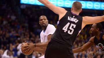 Mar 31, 2016; Oklahoma City, OK, USA; Oklahoma City Thunder forward Kevin Durant (35) handles the ball in front of Los Angeles Clippers center Cole Aldrich (45) during the third quarter at Chesapeake Energy Arena. Mandatory Credit: Mark D. Smith-USA TODAY Sports