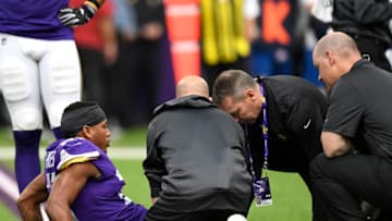 MINNEAPOLIS, MN - OCTOBER 14: Mike Hughes #21 of the Minnesota Vikings sits on the field after sustaining an injury in the fourth quarter of the game against the Arizona Cardinals at U.S. Bank Stadium on October 14, 2018 in Minneapolis, Minnesota. (Photo by Hannah Foslien/Getty Images)