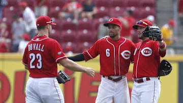 Aug 4, 2016; Cincinnati, OH, USA; Cincinnati Reds center fielder Billy Hamilton (6) celebrates with left fielder Adam Duvall (23) and right fielder Tyler Holt (40) after the Reds defeated the St. Louis Cardinals 7-0 at Great American Ball Park. Mandatory Credit: David Kohl-USA TODAY Sports