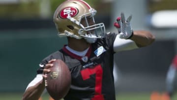 May 28, 2014; Santa Clara, CA, USA; San Francisco 49ers quarterback Colin Kaepernick (7) passes the football during organized team activities at the SAP Performance Facility. Mandatory Credit: Kyle Terada-USA TODAY Sports