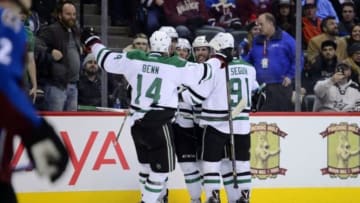 Feb 4, 2016; Denver, CO, USA; Dallas Stars defenseman Jason Demers (4) celebrates his game tying goal in the third period against the Colorado Avalanche at the Pepsi Center. The Stars defeated the Avalanche in overtime 4-3. Mandatory Credit: Ron Chenoy-USA TODAY Sports