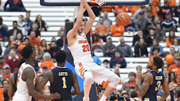 Jan 7, 2017; Syracuse, NY, USA; Syracuse Orange forward Tyler Lydon (20) dunks the ball between Pittsburgh Panthers forward Jamel Artis (1) and guard Damon Wilson (3) during the second half at the Carrier Dome. Syracuse won 77-66. Mandatory Credit: Rich Barnes-USA TODAY Sports