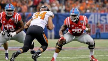 Jan 1, 2016; New Orleans, LA, USA; Mississippi Rebels offensive lineman Laremy Tunsil (78) blocks Oklahoma State Cowboys defensive end Jordan Brailford (94) during the second quarter in the 2016 Sugar Bowl at the Mercedes-Benz Superdome. Mandatory Credit: Derick E. Hingle-USA TODAY Sports