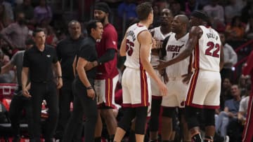 Head coach Erik Spoelstra of the Miami Heat yells at Jimmy Butler #22 during a timeout(Photo by Eric Espada/Getty Images)