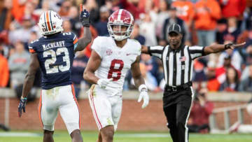 Auburn football defensive back Roger McCreary (23) celebrates after breaking up a pass intended for Alabama Crimson Tide wide receiver John Metchie III (8) during the Iron Bowl at Jordan-Hare Stadium in Auburn, Ala., on Saturday, Nov. 27, 2021. Auburn Tigers leads Alabama Crimson Tide 7-0 at halftime.