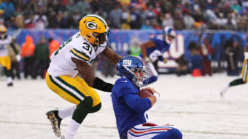 EAST RUTHERFORD, NEW JERSEY - DECEMBER 01: Daniel Jones #8 of the New York Giants slides in for a gain against Adrian Amos #31 of the Green Bay Packers during their game at MetLife Stadium on December 01, 2019 in East Rutherford, New Jersey. (Photo by Al Bello/Getty Images)