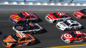 Feb 21, 2016; Daytona Beach, FL, USA; NASCAR Sprint Cup Series driver Carl Edwards (19), Kevin Harvick (4), Jaime McMurray (1), Ryan Blaney (21), Brad Keselowski (2) and Kyle Larson (42) during the Daytona 500 at Daytona International Speedway. Mandatory Credit: Mike DiNovo-USA TODAY Sports